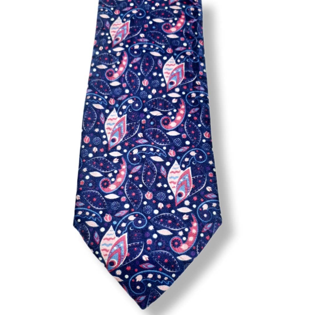 A necktie with a detailed paisley pattern in navy blue, pink, and white, shown against a plain white background.