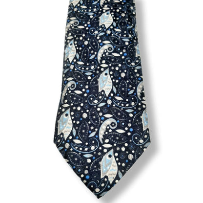 A necktie with a dark navy blue background featuring a detailed pattern of stylized fish, paisley swirls, and small stars in light blue, white, and silver.