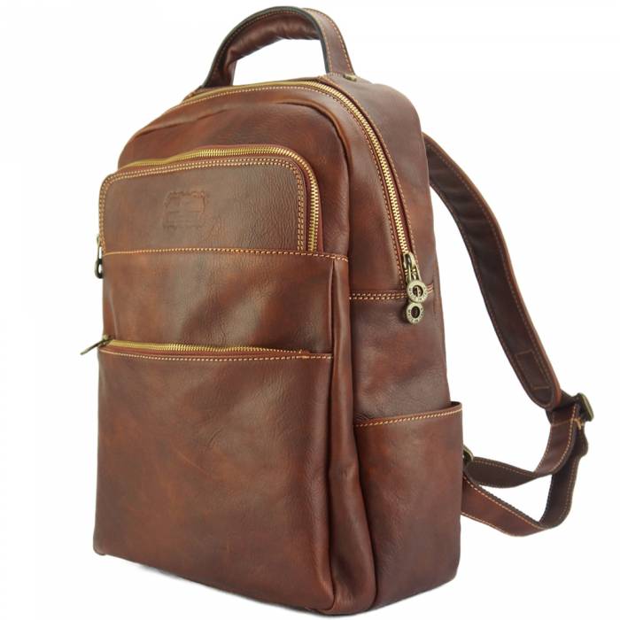 Brown leather backpack on a white background