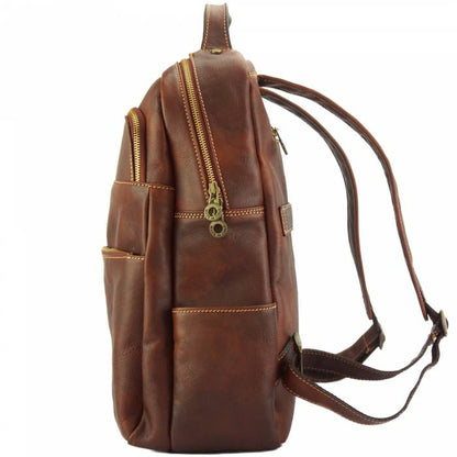 Brown leather backpack with gold zipper on a white background