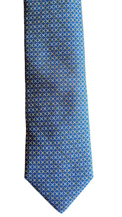 A blue necktie with a repeating geometric pattern of small yellow and white shapes, shown flat against a plain white background.